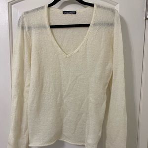Great sweater for Fall/winter. Thin material in an ivory color.